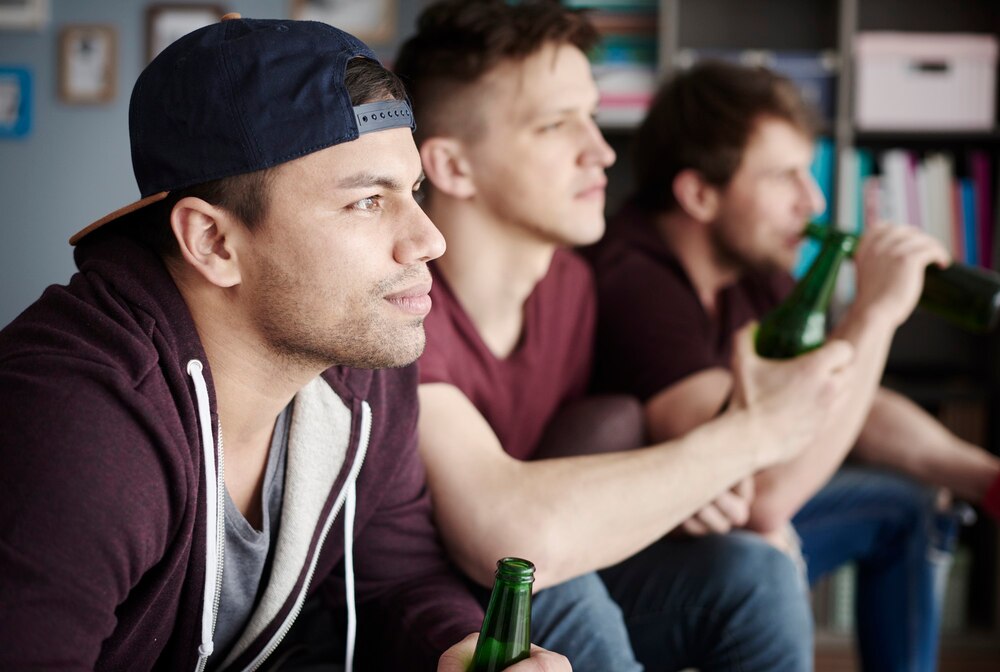 Side view of three confident fans
