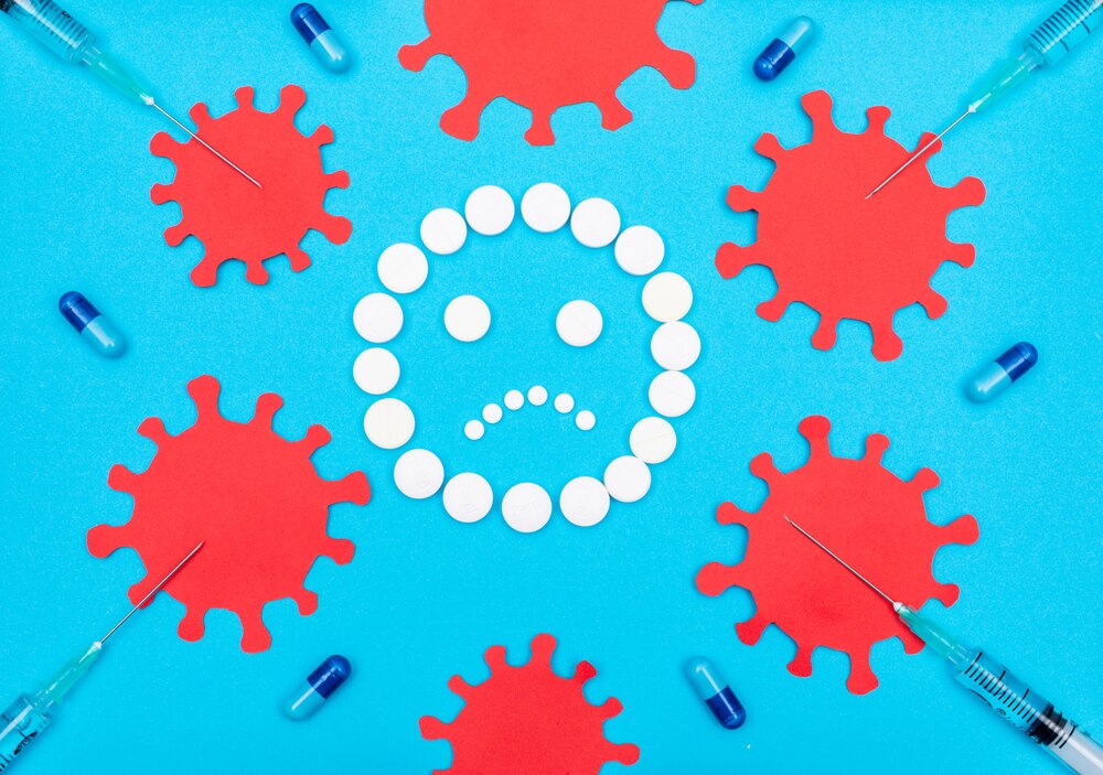 Set of virus nearby and pills forming sad emoji with needles and pills